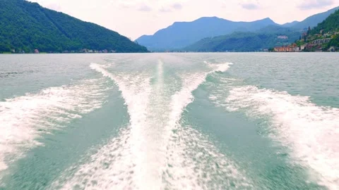 Rear View From a Boat Point of View with a Wake and Landscape with Houses Stock Footage 285430132