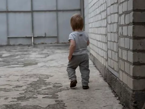 Rear view of boy running Foto stock