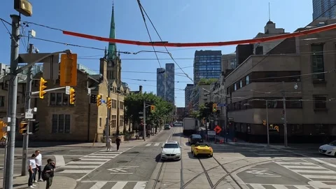 Rear view from bus of bustling Toronto city street Stockbeeldmateriaal 302575961
