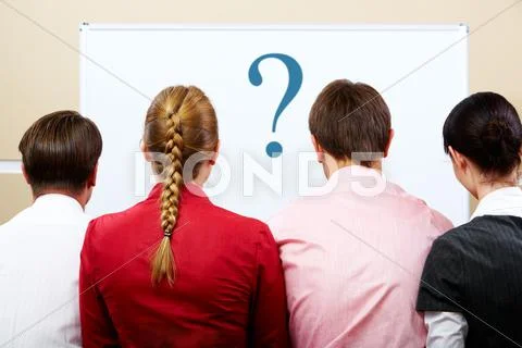 Rear view of business team with whiteboard in front of them Stock Photos