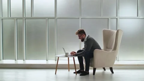 Rear view of businessman in an office with panoramic city view. Businessman 库存影片 134792138