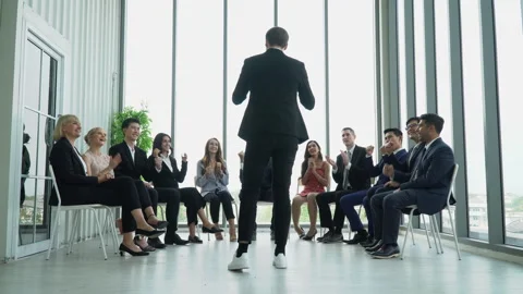 Rear view of businessman standing speech motivation conference in seminar. .. Stock Footage 244031685