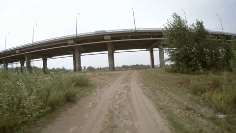 Rear view of car driving along a rural dirt road Stock Footage 76102871