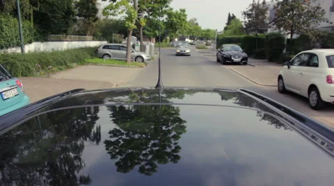 Rear view of car driving through residential area Stock Footage 41544505