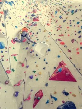 Rear view of a climber on artificial wall. Stock Photos