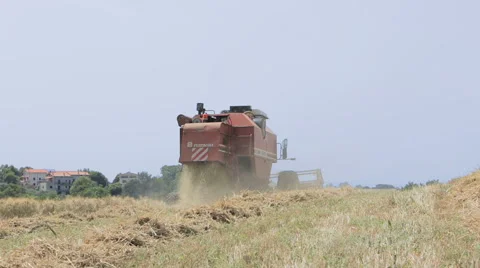 Rear view of combine harvester at work: agriculture Video stock 40298484