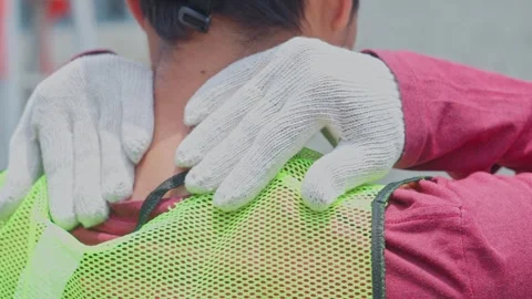 Rear view of construction worker massaging stiff neck experiencing muscle Stock Footage 337165180