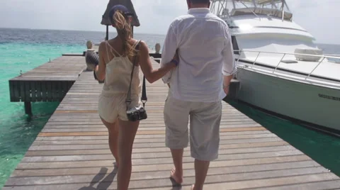 Rear View Of Couple Approaching Cruise Boat Stock Footage 50171014