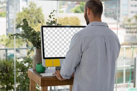 Rear view of designer using computer in office Stock Photos