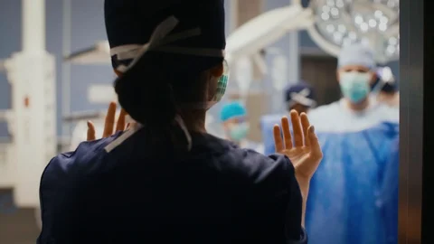 Rear view of doctors before hard operation Stock Footage 105350837