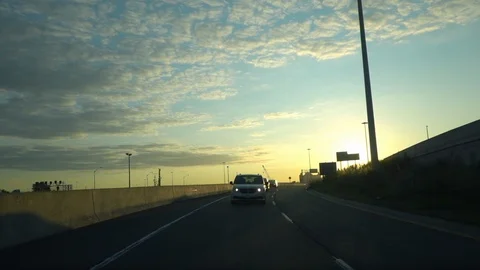 Rear view driving on highway at sunset Stock Footage 118907796