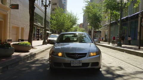 Rear view of a Driving Plate: Car begins on SW Morrison Street in Portland, Stock Footage 59316015