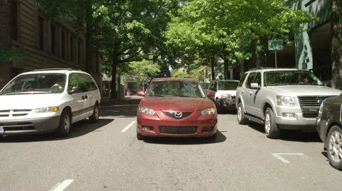 Rear view of a Driving Plate: Car travels along Madison Street from its Stock Footage 59318763
