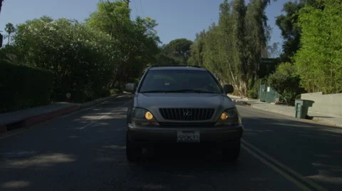 Rear view of a Driving Plate: Car turns left from South Oak Knoll Avenue in Stock Footage 59334147