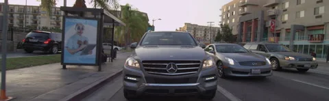 Rear view of a Driving Plate: Car turns right from Cesar E. Chavez Avenue in Stock Footage 59433166