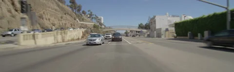 Rear view of a Driving Plate: Car travels on Highway 1 from California Incline Stock Footage 59485771