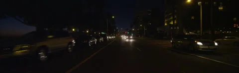 Rear view of a Driving Plate: Car travels on Ocean Avenue from Wilshire Stock Footage 59509245