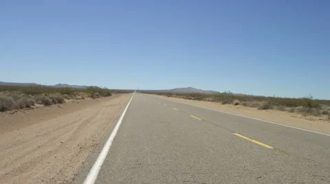 Rear view of a Driving Plate: Car travels east on Shadow Mountain Road through Stock Footage 59510529