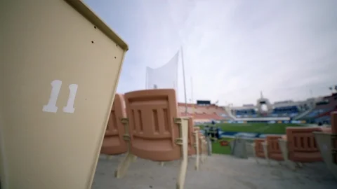 Rear view of empty seats in American football stadium Stock Footage 104769569