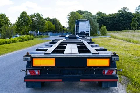 Rear view of an empty semi-trailer standing on the side of the road Stock Photos