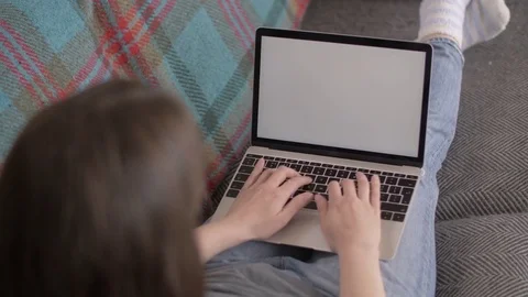 Rear View Of Female Blogger Using Laptop On Sofa Stock Footage 79657608