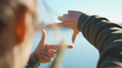 Rear view female hands making frame with fingers Stock Footage 126002765