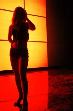 Rear view of a Female Model at studio Stock Photos
