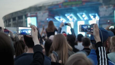 Rear view of festival crowd raising their hands. Open air concert hip hop rap Stock Footage