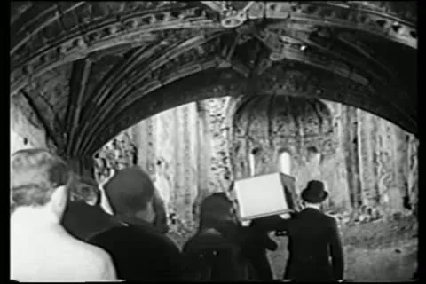 Rear view of funeral procession walking through ruins Stock Footage 11354270