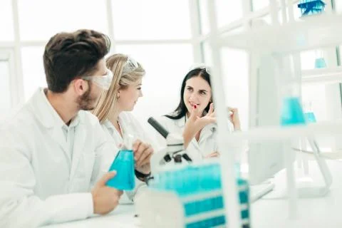Rear view.a group of scientists working in a modern laboratory Stock Photos