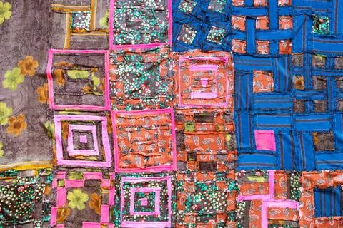 Rear view of handcrafted motley patchwork cloth textile background - rear ... Fotos de archivo