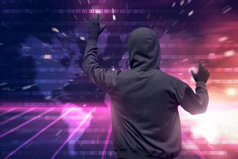 Rear view of hooded hacker using virtual screen to hacking Stock-Fotos