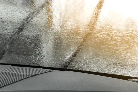 Rear view from inside mirror car,window windshield glass covered with frozen ice Stock Photos