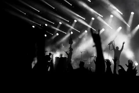 Rear view of large group of unrecognizable people at concert Stock Photos
