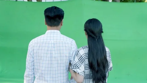 Rear view of lovers walking forward on in studio Video stock 80644915