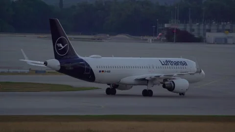 Rear view of Lufthansa passenger airplane taxiing on the taxiway Stock Footage 246865215