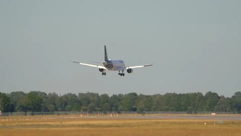 Rear view of a Lufthansa passenger airplane arrival Stock Footage 252121858
