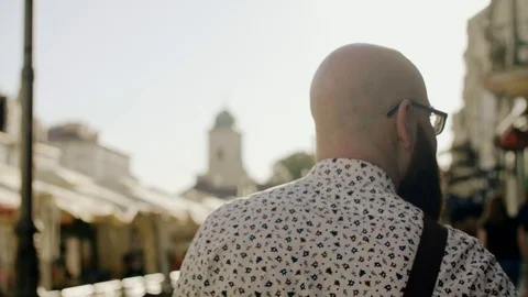 Rear view of man going down the street Stock-Footage 90948751