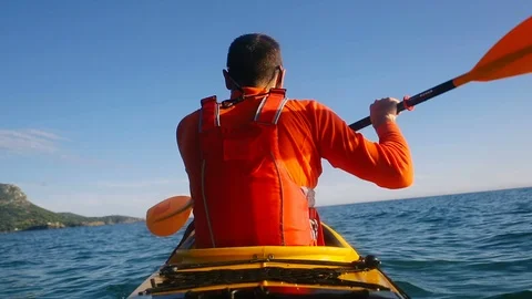 Rear view of man paddling Stock Footage 112569008