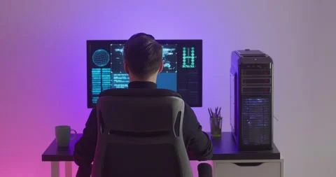 Rear view of man programmer working at computer, male hacker coding typing code Stock Footage 160901438