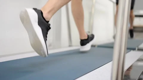Rear view of man running during a cardiac stress test Stock Footage 258980224