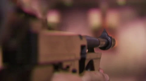 Rear view of man shooting target with gun Stock Footage 55570857