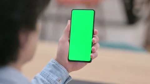 Rear View, Man using Smartphone with Green Chroma Key Screen Stock Footage 145792802