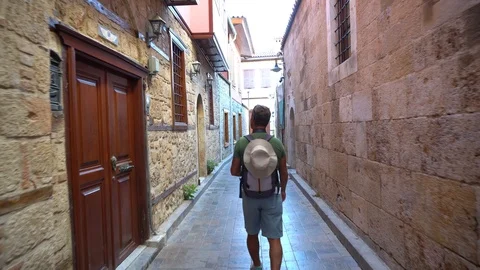 Rear View Of Man With Walking In Old City. Stock Footage 105830820