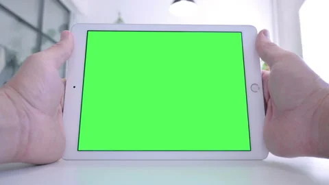 Rear View of Man Watching Tablet with Chroma Screen Video stock 143561703