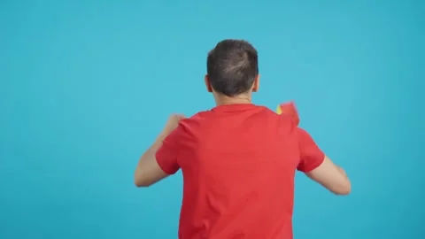 Rear view of a man waving a begian pennant Stock Footage 262945088