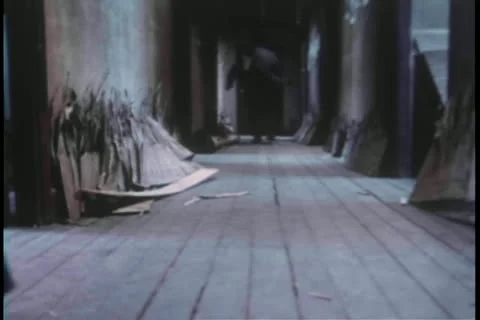 Rear view of men running down hallway Vídeos de archivo 11348631