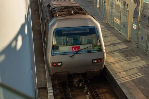 Rear View of Metro Train at Halic Station with Turkish Flag Фото