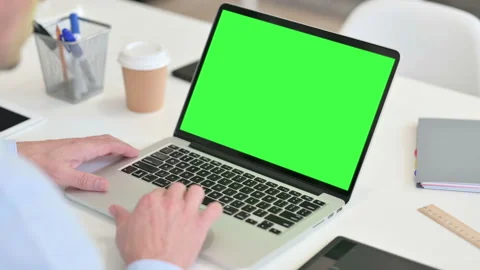 Rear View Middle Aged Man using Laptop with Chroma Screen Video stock 143587351
