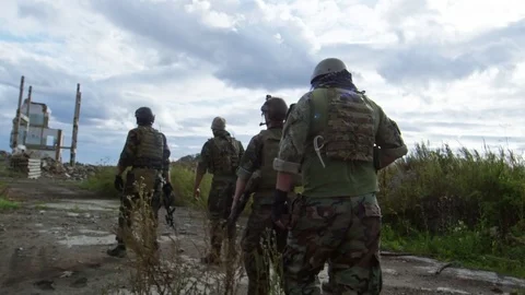 Rear View of Military Squad Walking Together Stock Footage